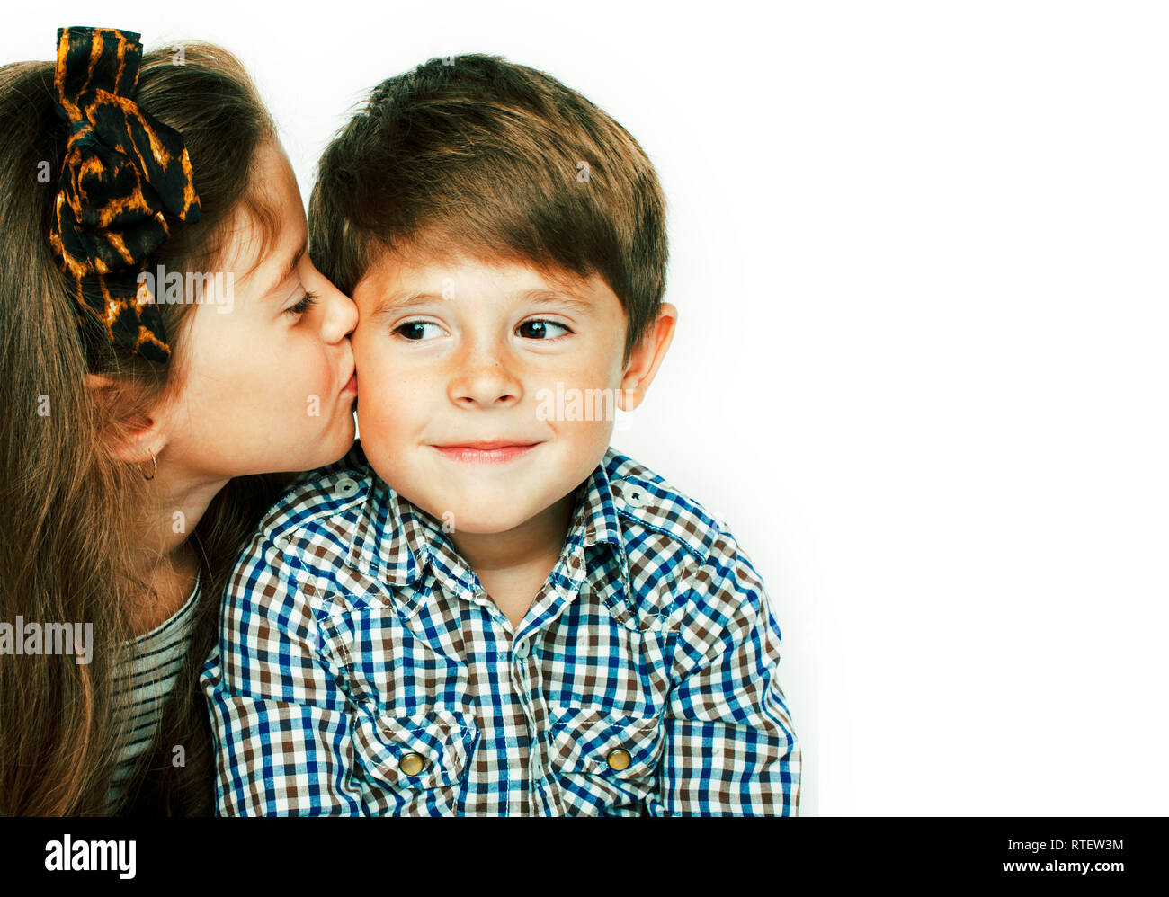 little cute boy and girl hugging playing on white background Stock ...