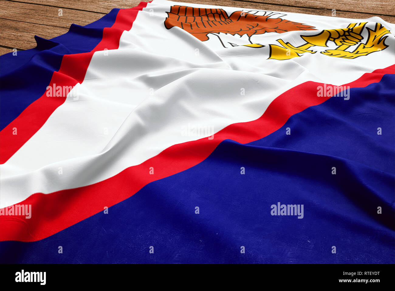 Flag of American Samoa on a wooden desk background. Silk flag top view. Stock Photo