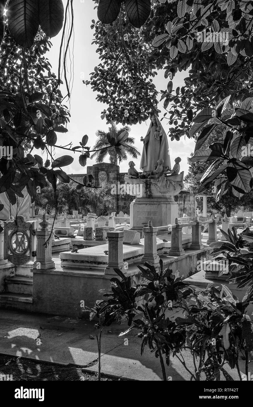 Havana, Cuba - 08 January 2013: The cemetery of Havana in Cuba. A view of the tomb from the bushes. Stock Photo