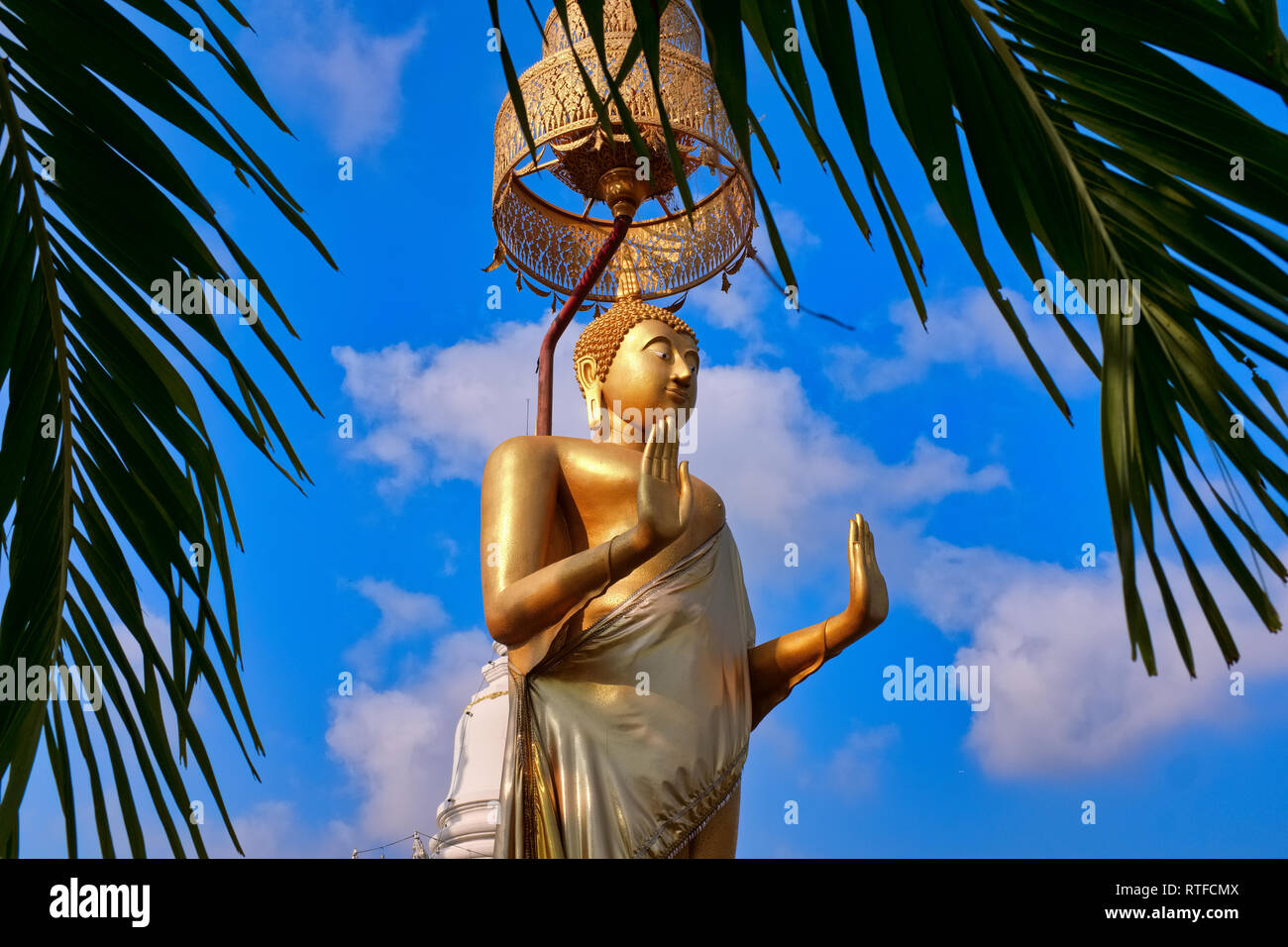 A large standing Buddha in front of Wat Pichaiyat, Thonburi, Bangkok