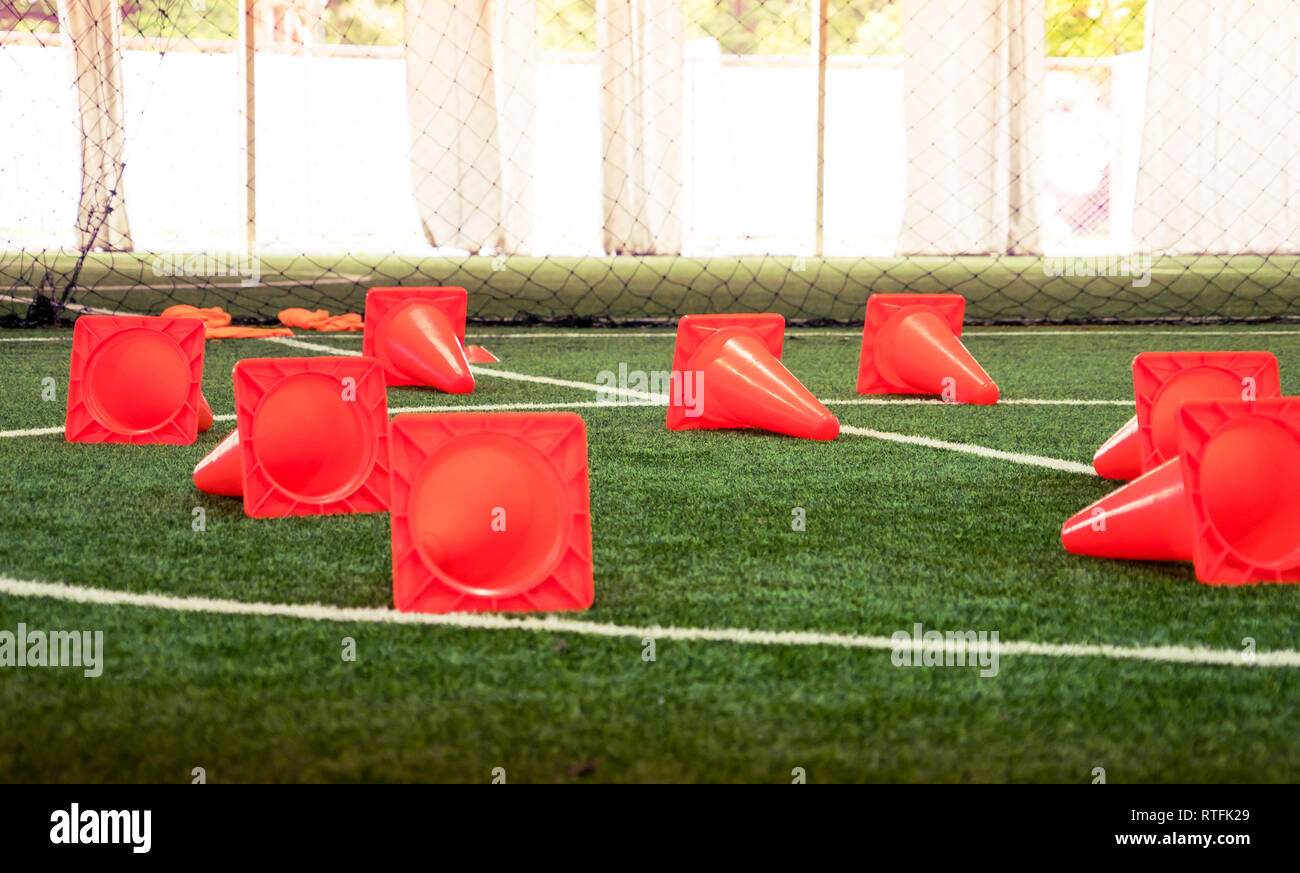 Plastic sport training cone on indoor soccer field Stock Photo Alamy