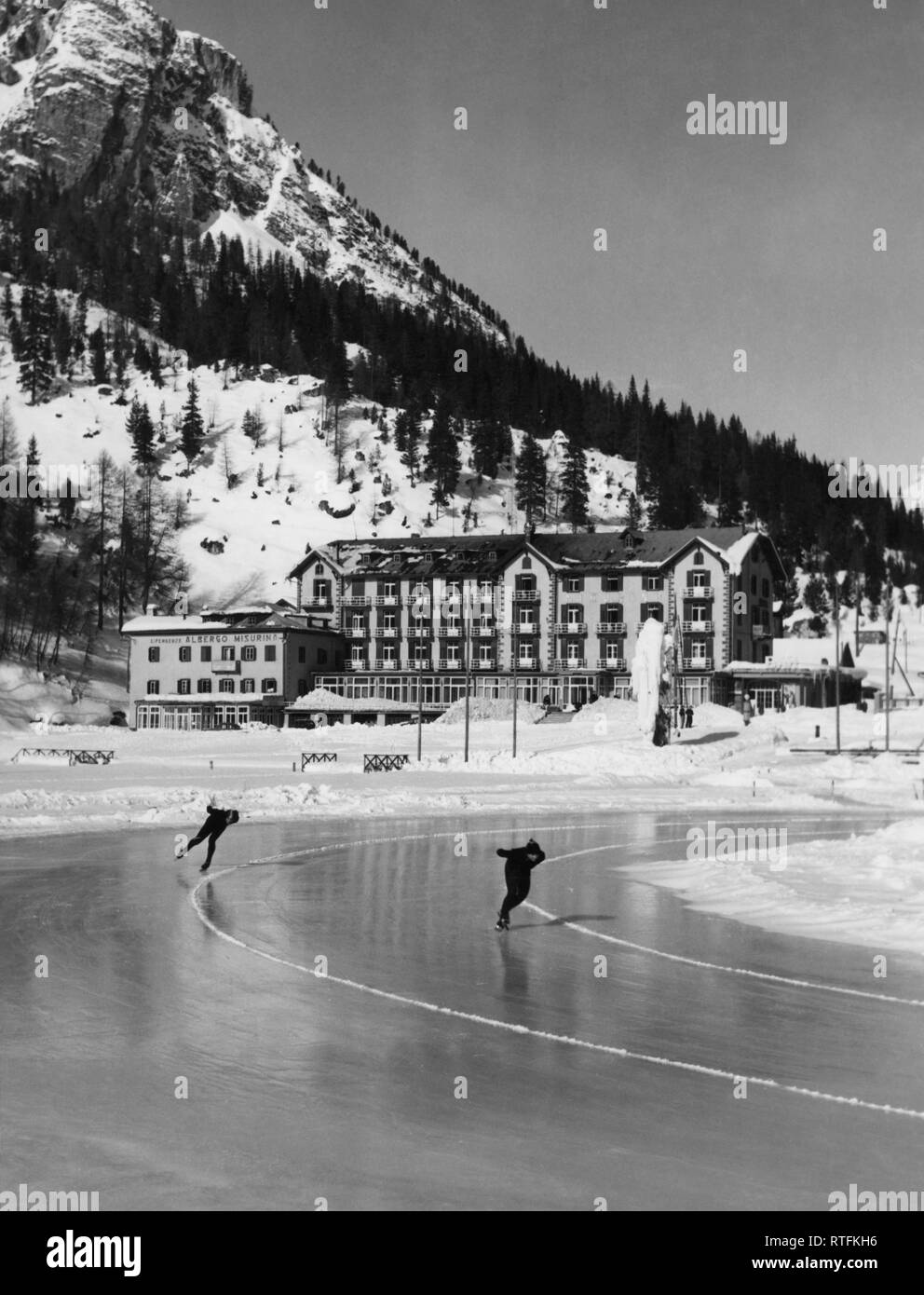 Italy, Veneto, Auronzo di Cadore, skating rink on Lake misurina, 1955 Stock Photo