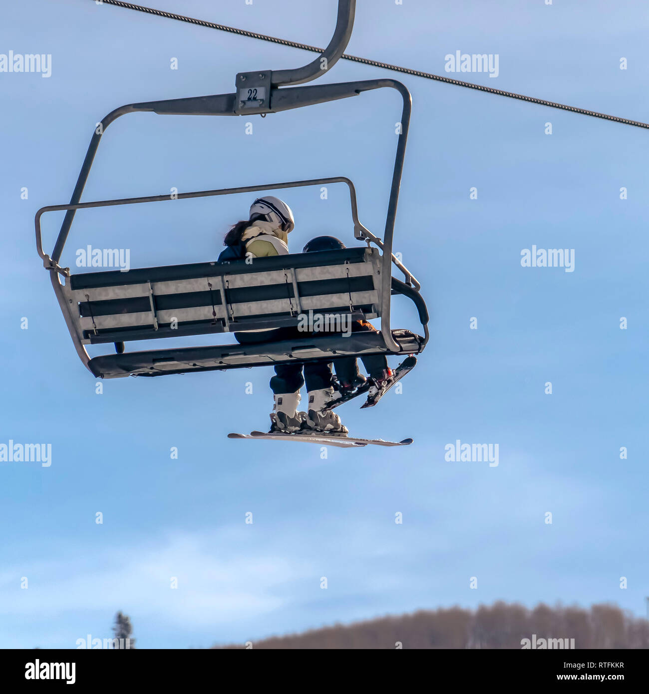 Ski Lift With Woman And Child Against Blue Sky Ski Lift In Park City Utah Ski