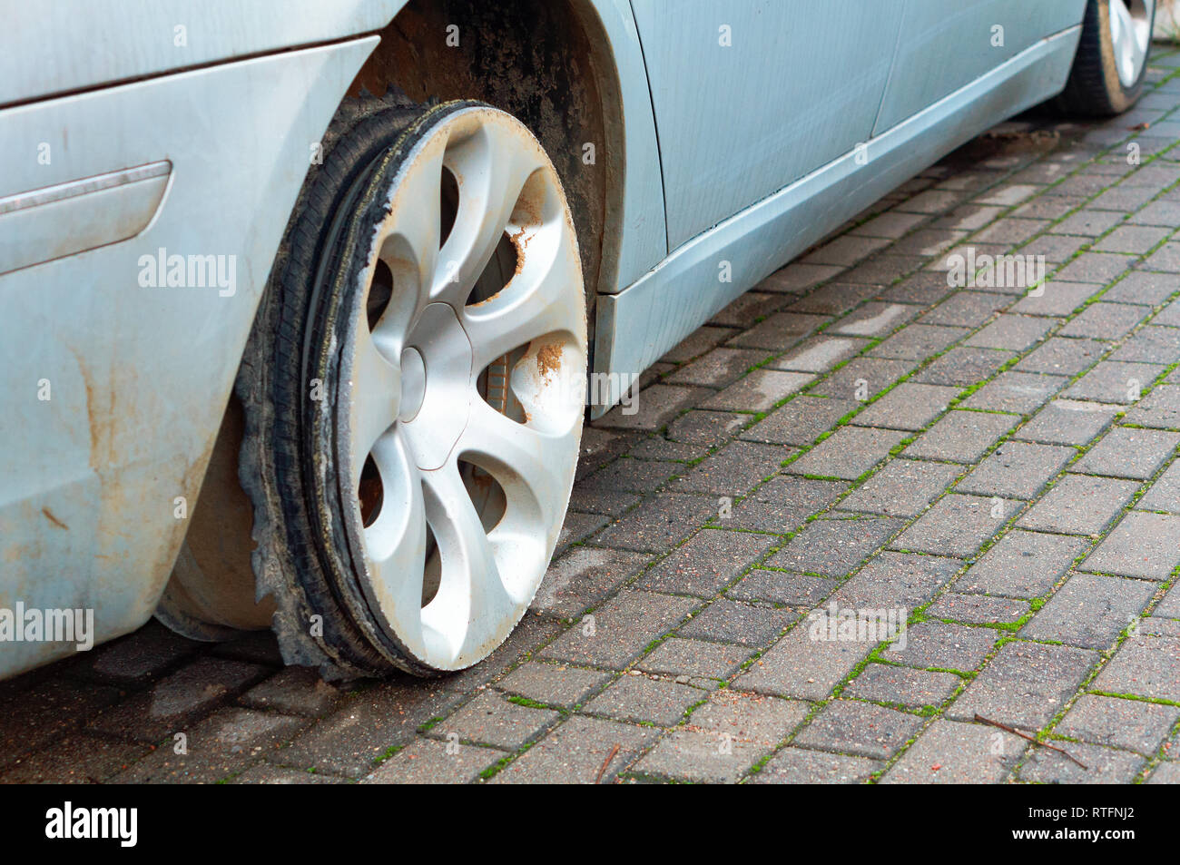 car wheel without the tyre, the torn rubber on the wheel of a car Stock