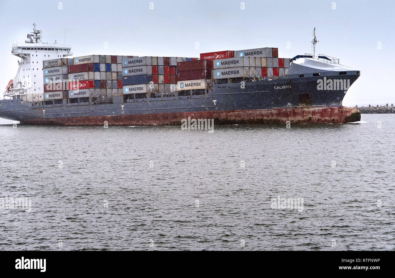 container ship, cargo ship in winter, Baltic sea canal, shipping channel Baltic sea, Baltiysk, Kaliningrad region, Russia, 16 December 2018 Stock Photo