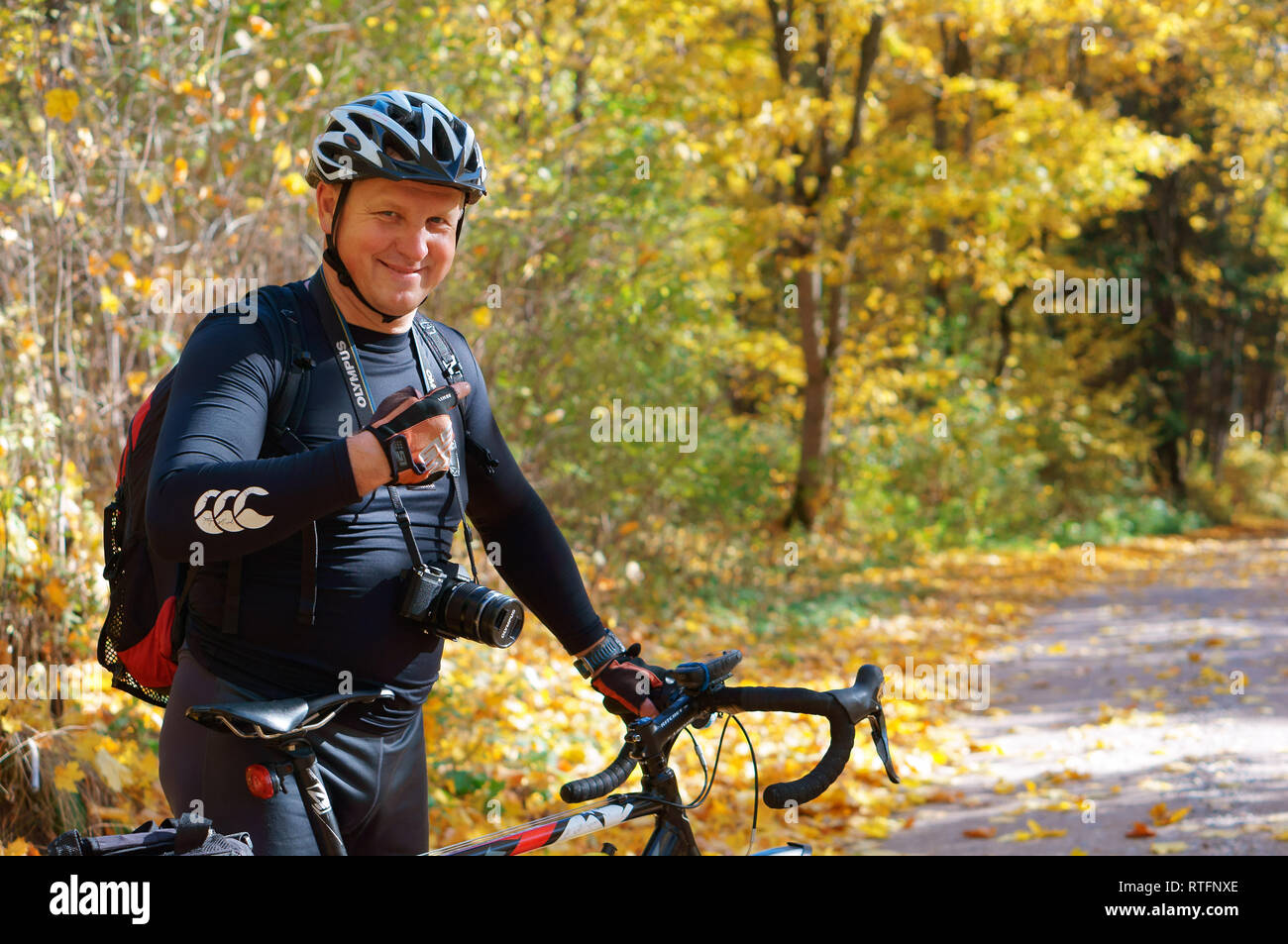 Kaliningrad region, Russia, October 13, 2018. Man with Bicycle in autumn forest. Stock Photo