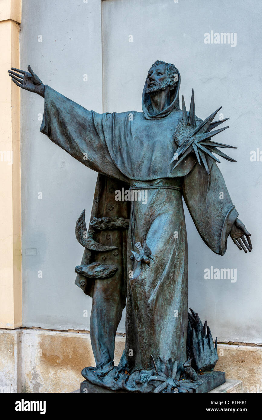 Statue of Saint Francis of Assisi in Vienna. It was installed on the north side of Minoritenkirche church in 2003 Stock Photo