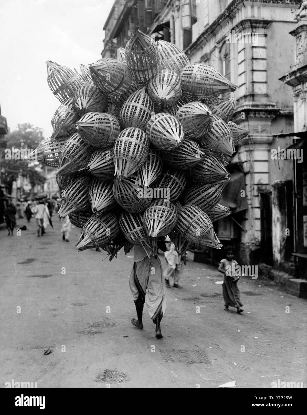 asia, india, bombay, vendor of baskets, 1952 Stock Photo