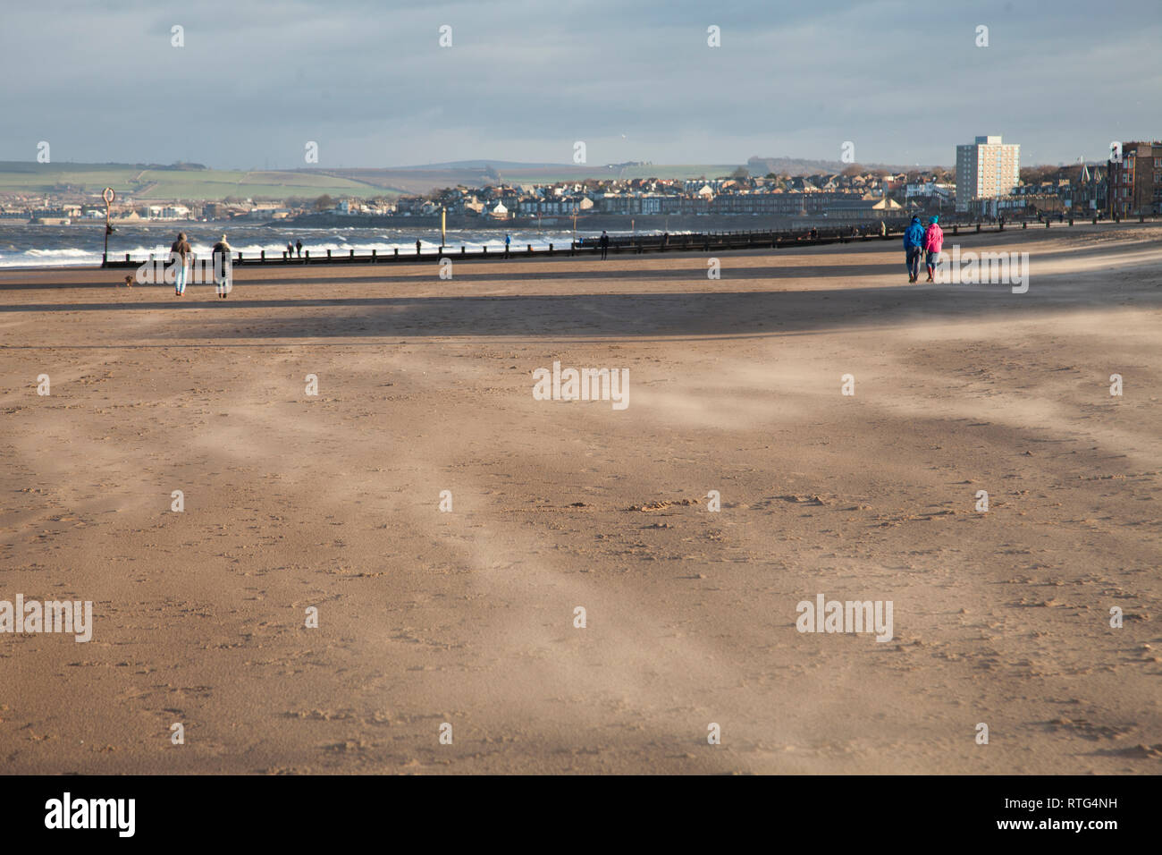 Sunny and very windy weather on a bright day on Portobello beach in Edinburgh, capital of Scotland. Stock Photo