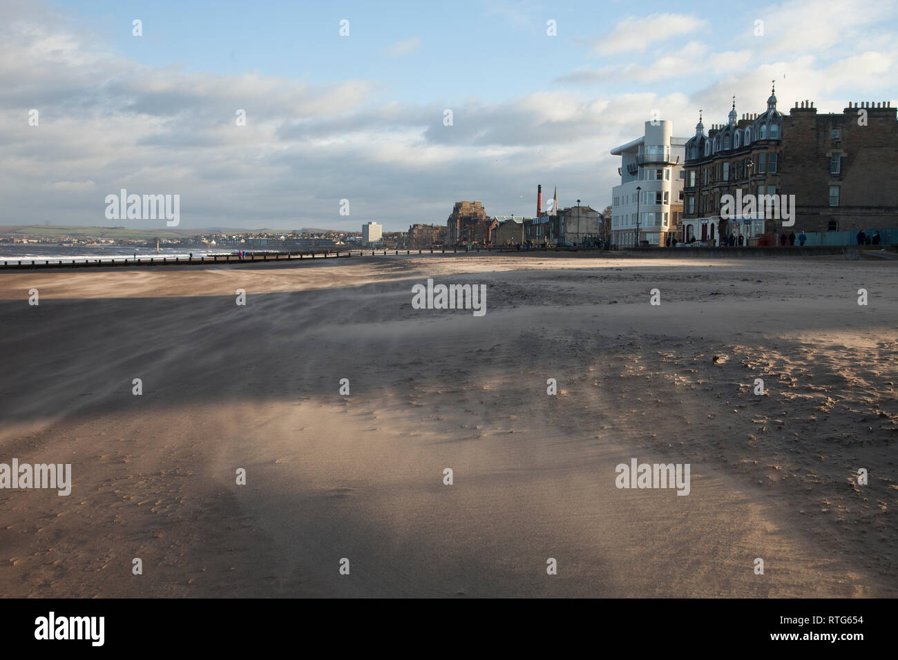 Sunny and very windy weather on a bright day on Portobello beach in