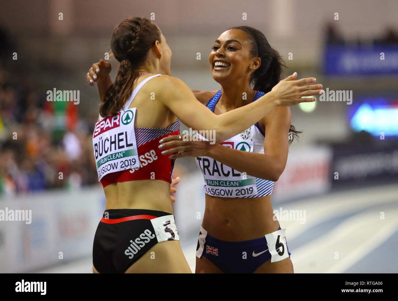 Great Britain's Adelle Tracey (right) hugs Switzerland's Selina Buchel after the Women's 800m Heat 1 during day one of the European Indoor Athletics Championships at the Emirates Arena, Glasgow. Stock Photo