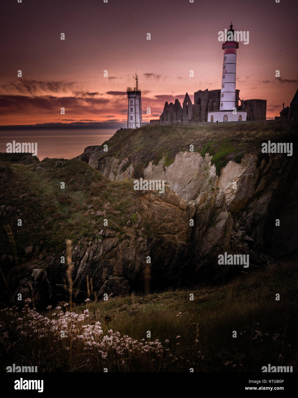 Saint Mathieu lighthouse in Brittany at sunset in France Stock Photo ...