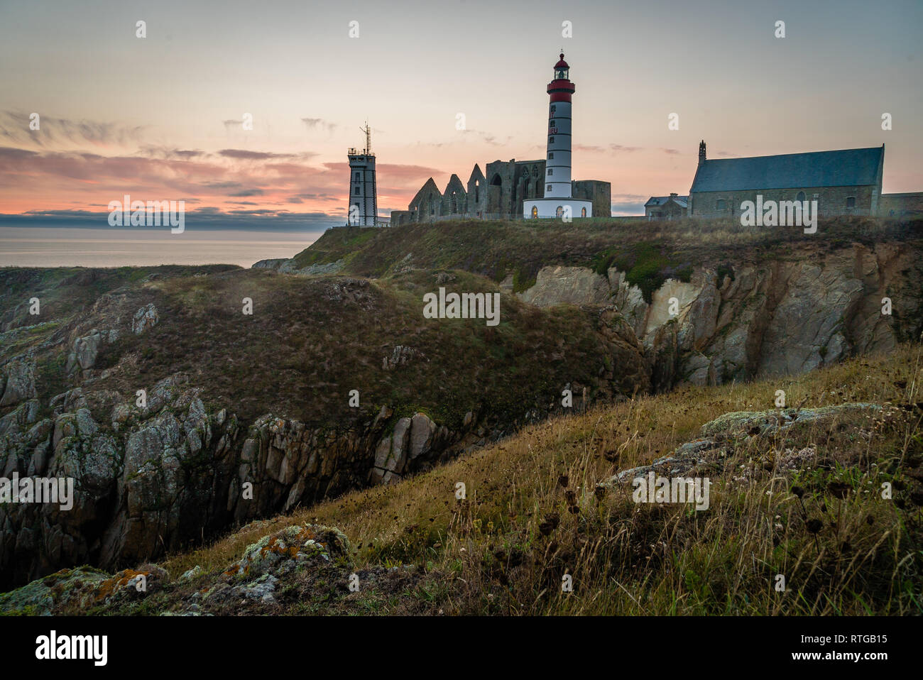 Saint Mathieu lighthouse in Brittany at sunset in France Stock Photo