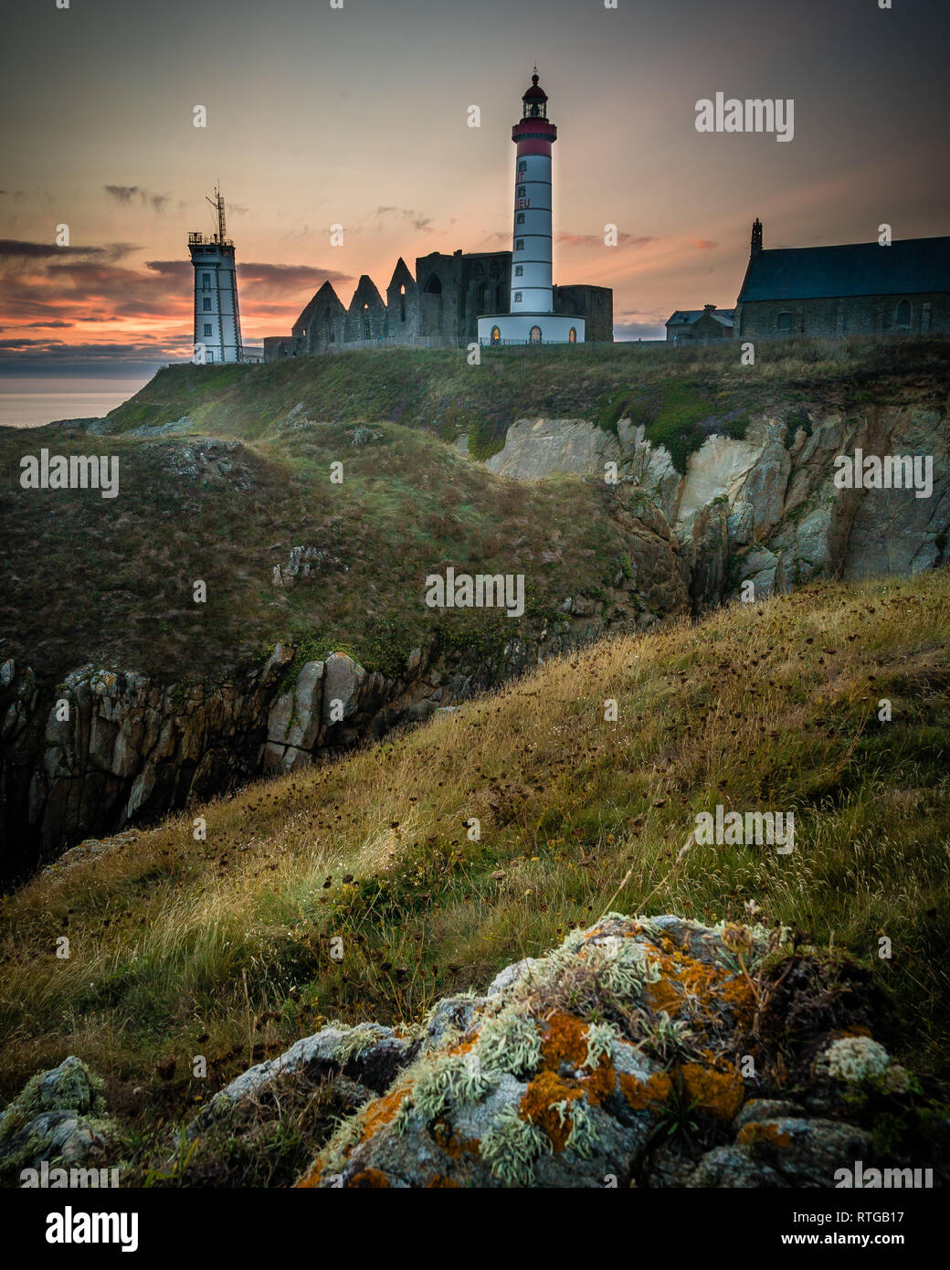 Saint Mathieu lighthouse in Brittany at sunset in France Stock Photo ...
