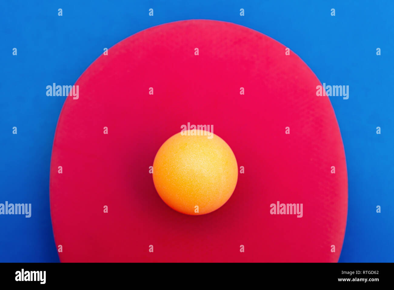 pingpong racket and ball on a blue background Stock Photo