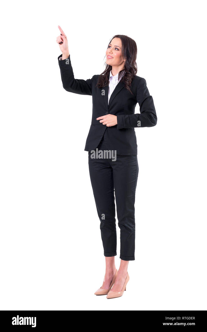 Friendly smiling business woman pointing finger using touch screen on virtual reality. Full body isolated on white background. Stock Photo