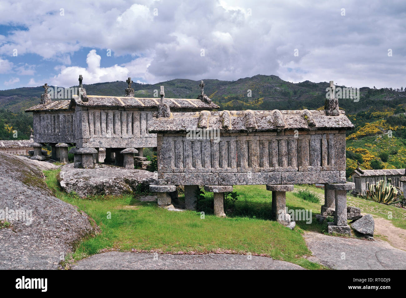 Traditional granite stone corn store houses in mountain region Stock Photo