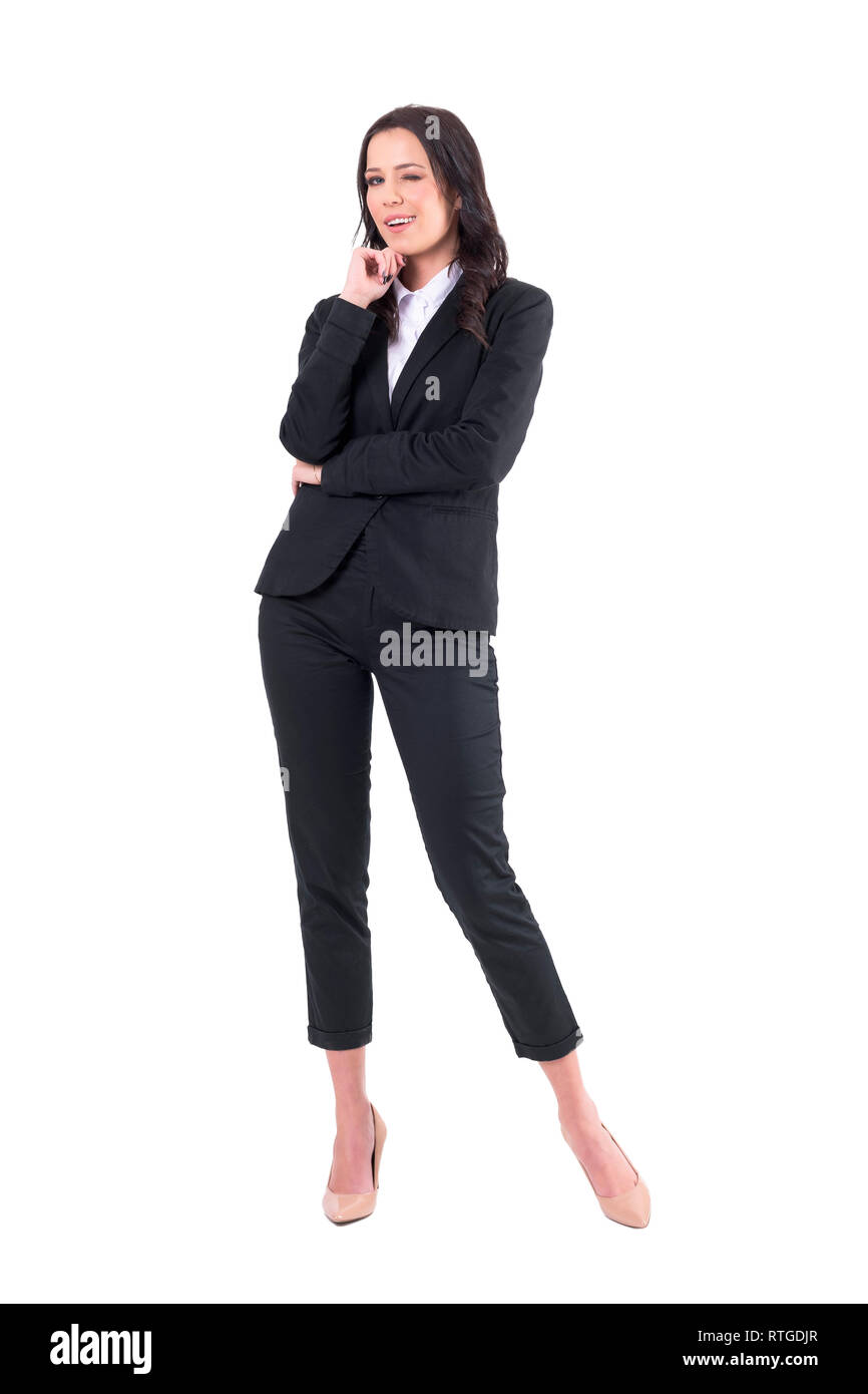 Confident successful elegant business lady winking at camera. Full body isolated on white background. Stock Photo