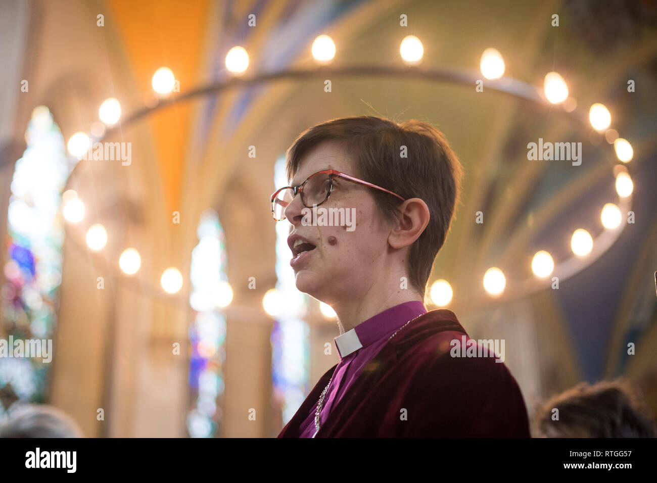 Bishop of Derby Right Reverend Libby Lane sings at a service of celebration to mark the 25th anniversary of the ordination of women to the priesthood in the Church of England, at Lambeth Palace, London. Stock Photo