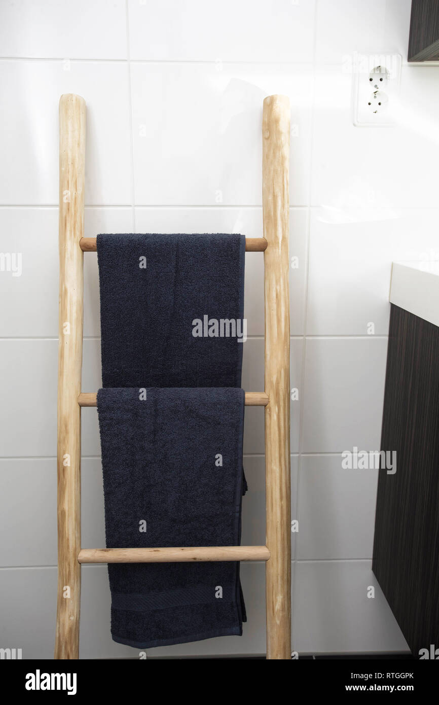 wooden towel hanger ladder bathroom with clean towels Stock Photo - Alamy
