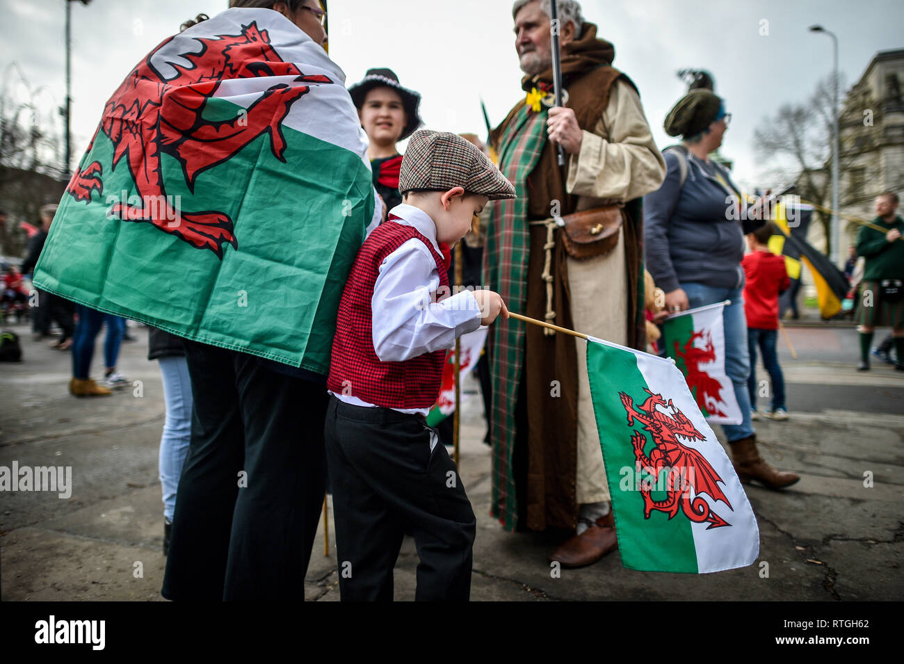 Welshman People wear traditional Welsh dress and carry the national flag during ...