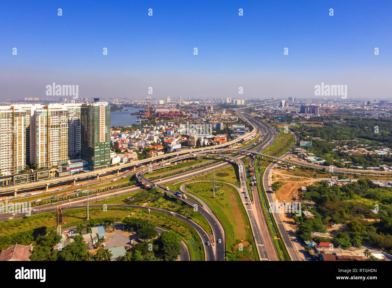 Top view aerial of Ha Noi highway to district 9 and Cat Lai crossroads, Ho Chi Minh City with development buildings, transportation, Vietnam Stock Photo