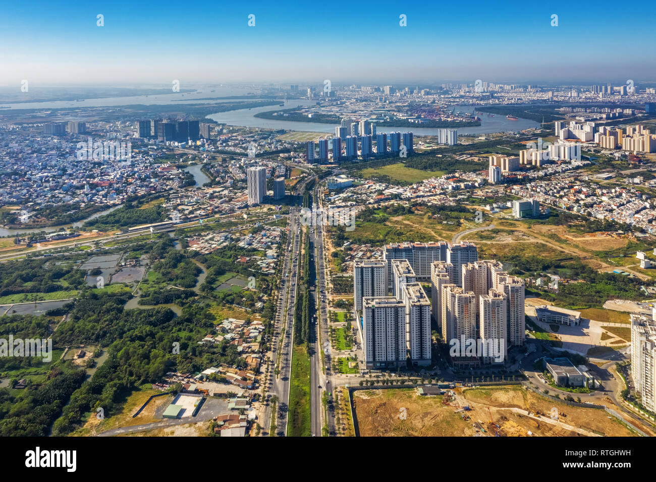 Top view aerial of Mai Chi Tho street. Ho Chi Minh City with development buildings, transportation, energy power infrastructure. Vietnam. Stock Photo