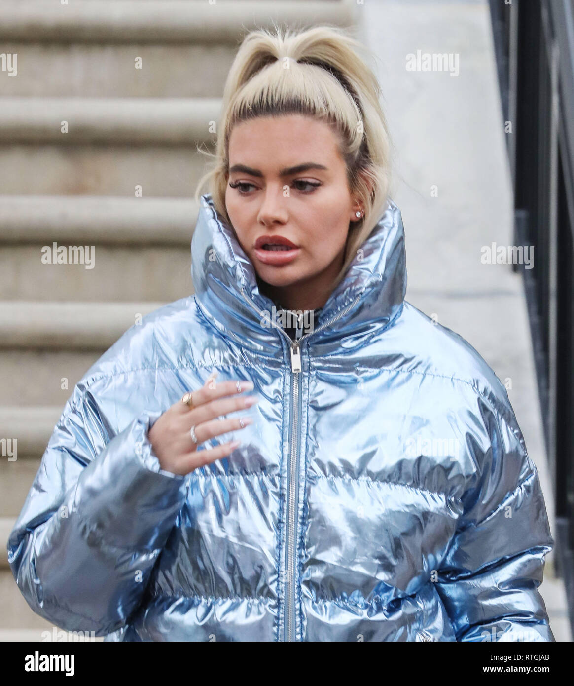 Megan Barton-Hanson leaves her London home wearing a silver puffer