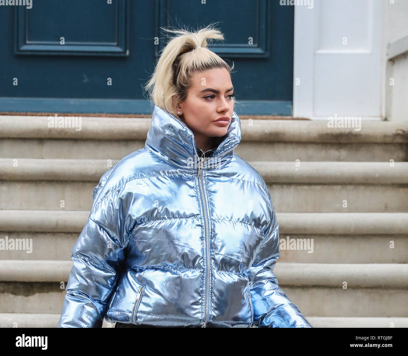 Megan Barton-Hanson leaves her London home wearing a silver puffer jacket  and carrying a blue