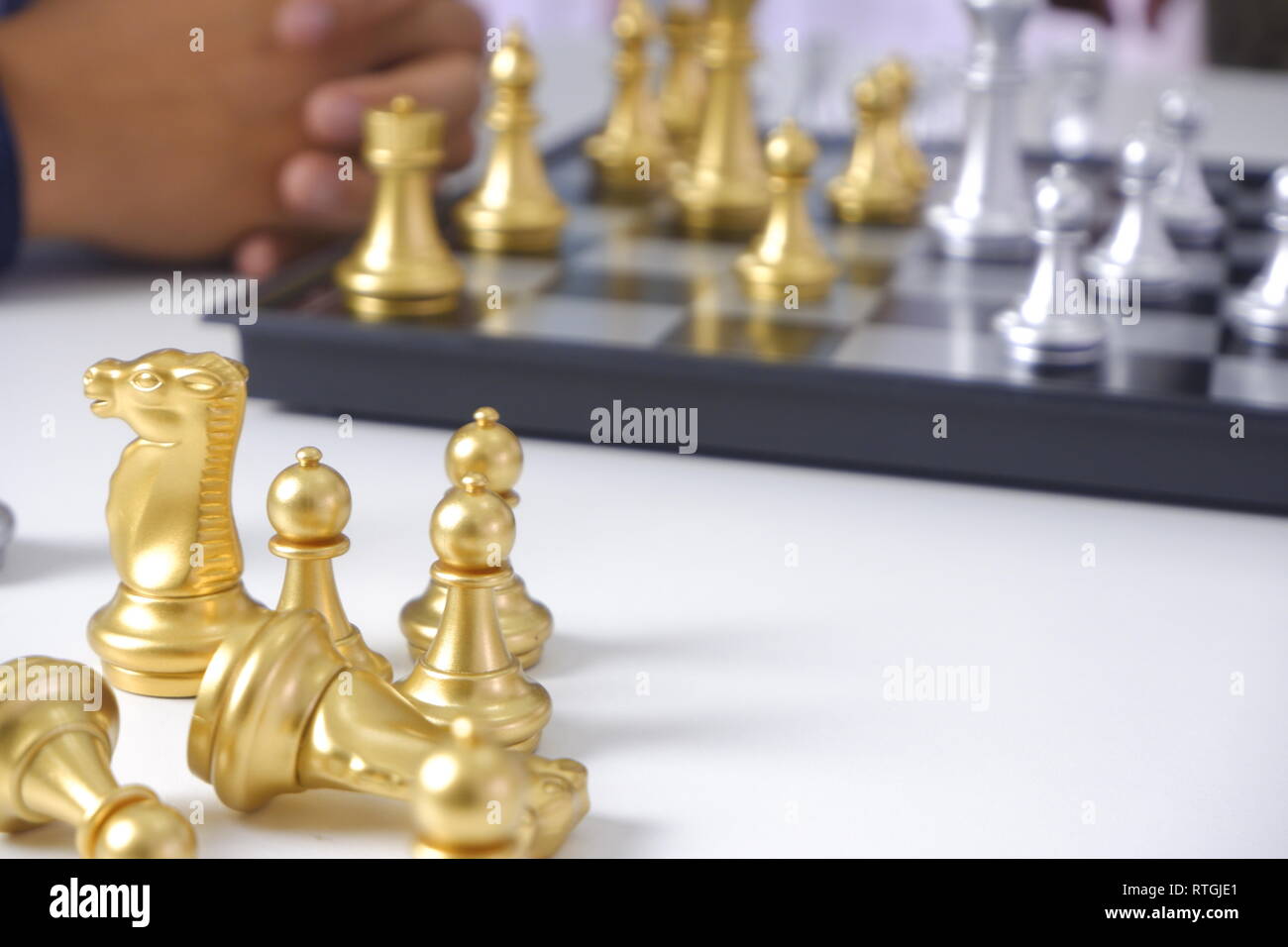 Businessman playing chess game; business strategy, leadership and management concept. Stock Photo