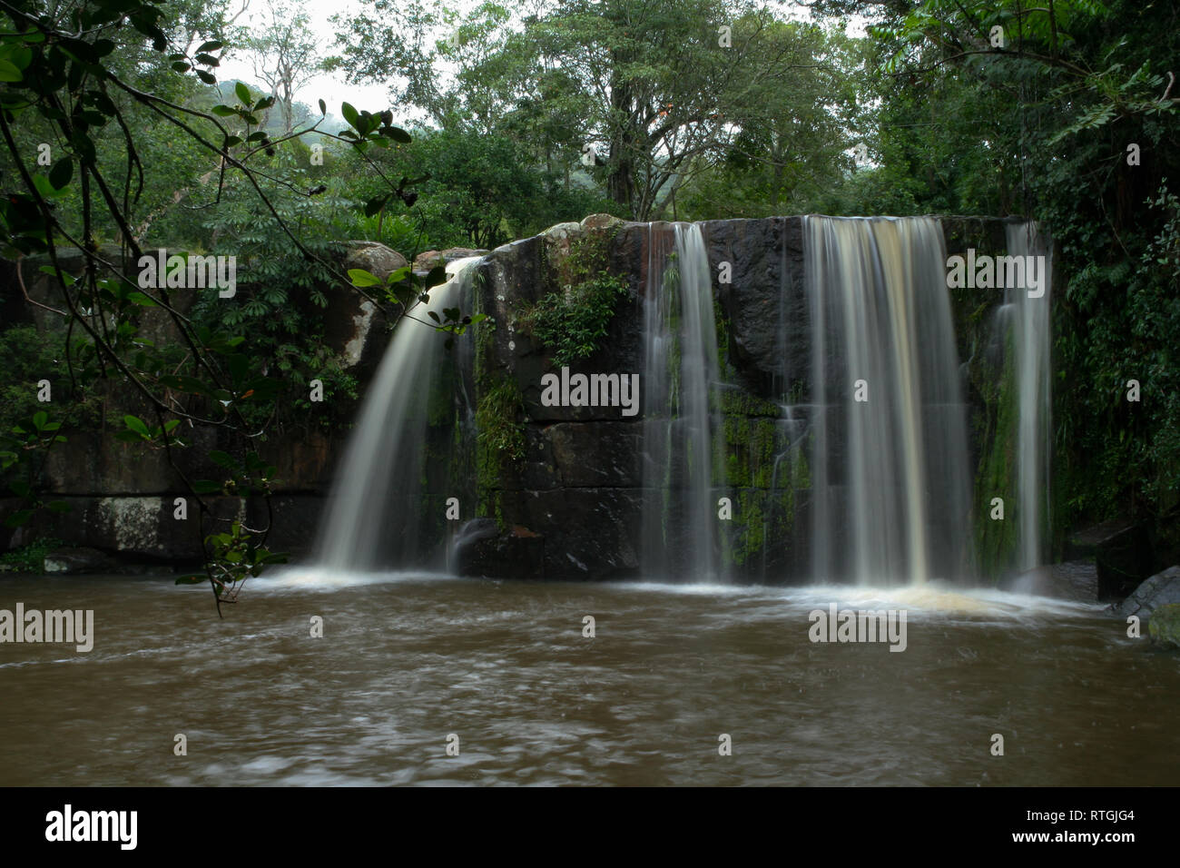 Salto Minas waterfalls secluded in a rainforest, surrounded by