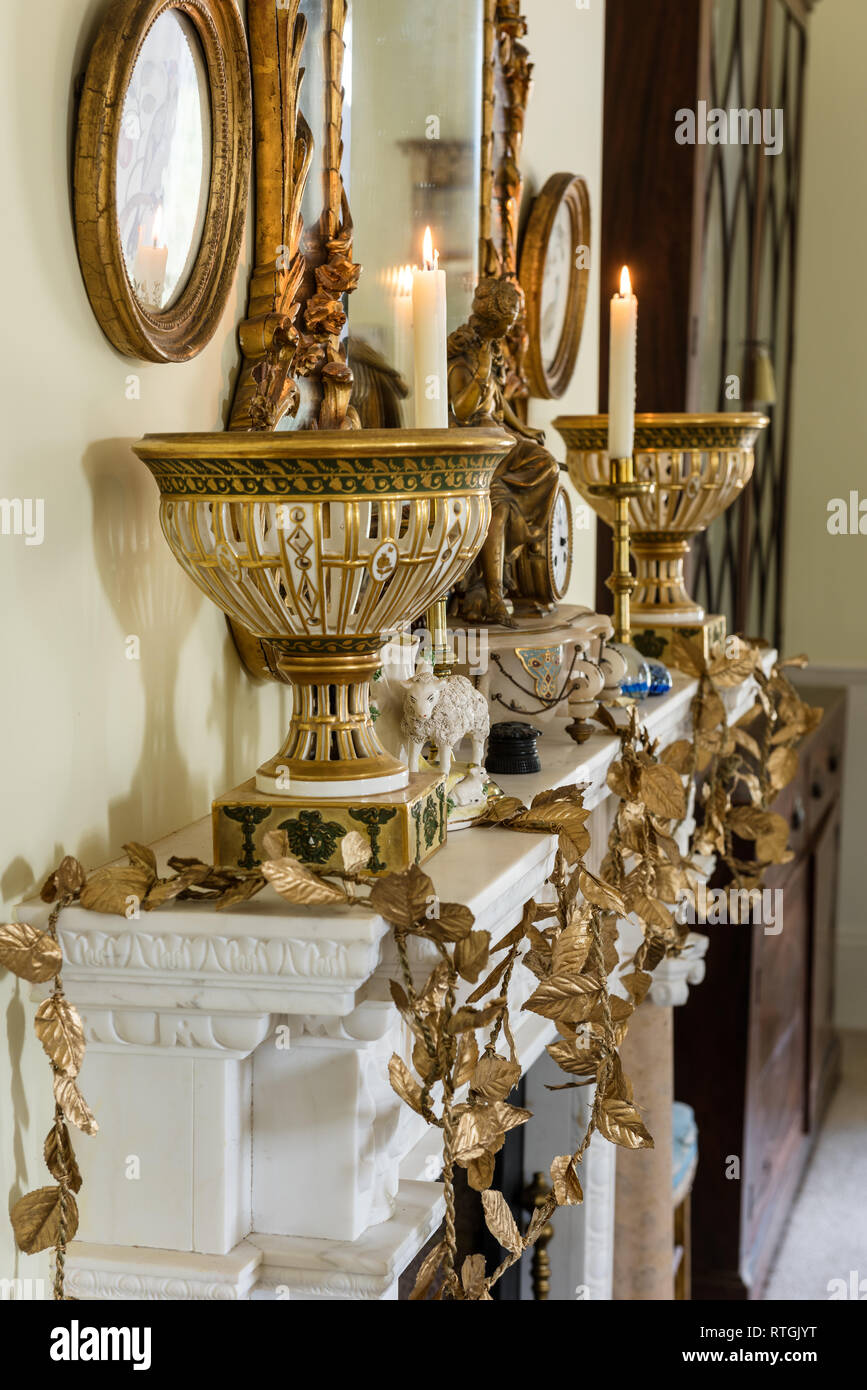 Goldleaf garland on English fireplace Stock Photo