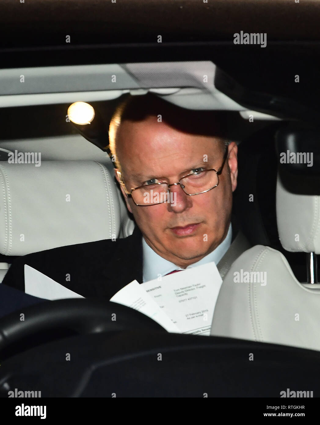 Transport Secretary Chris Grayling leaving the Houses of Parliament in Westminster, London. A Eurotunnel payout has led to further calls for him to resign, but Downing Street insisted it had full confidence in the Transport Minister. Picture dated 27/02/2019 Stock Photo