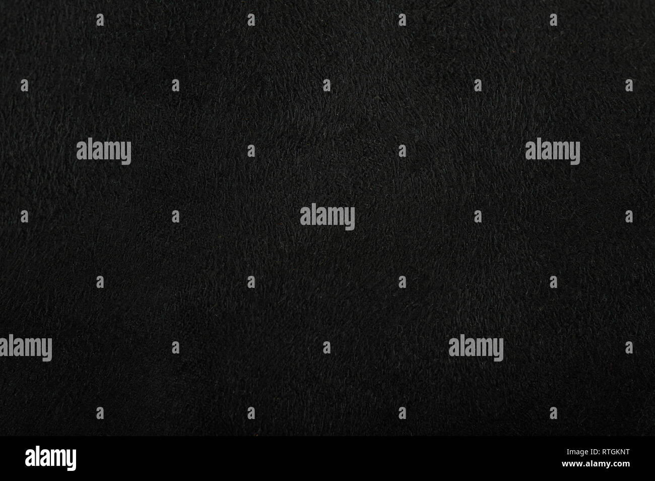 Black canvas background. Dark cotton surface texture Stock Photo