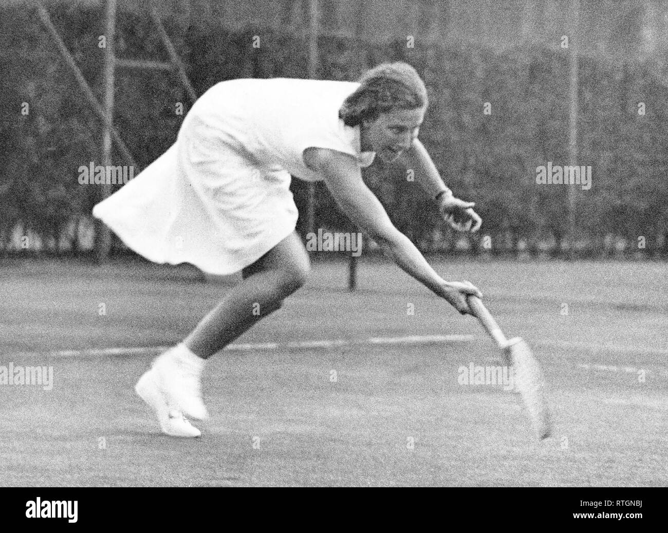 Photo Must Be Credited ©Alpha Press 050000 02/08/1934 Miss M Gardiner (St. Paul's Girls School) in her Singles march. Miss Rowe eventually won 6-3, 4-6, 6-2. The Schoolgirls Lawn Tennis Championships at Queen's Club in West Kensington, London. Stock Photo