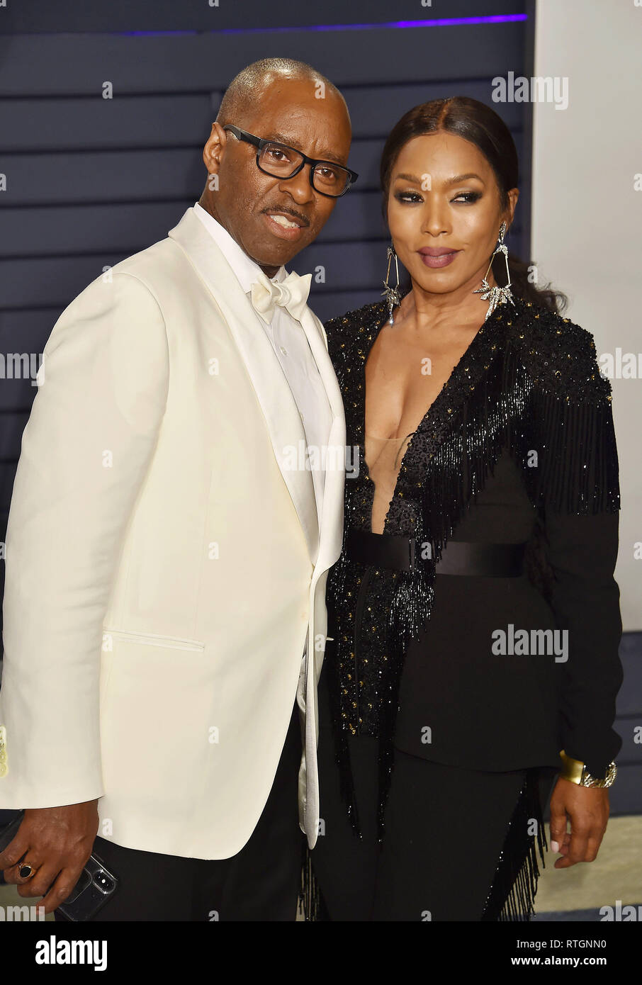 BEVERLY HILLS, CA - FEBRUARY 24: Courtney B. Vance (L) and Angela Bassett attend the 2019 Vanity Fair Oscar Party hosted by Radhika Jones at Wallis An Stock Photo