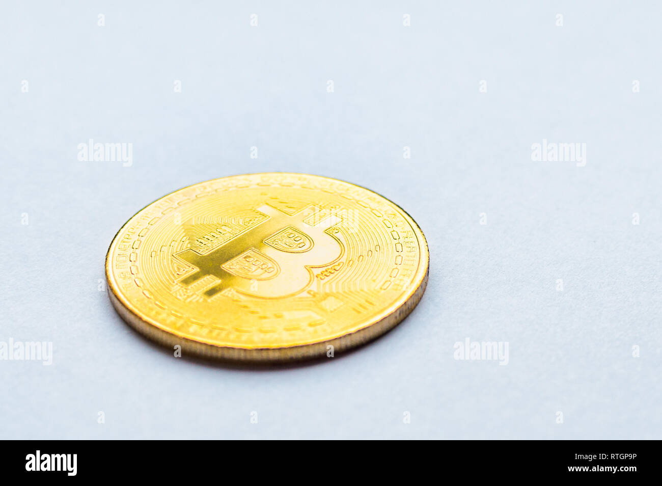 Golden bitcoin on white background. Concept mining. Copyspace Stock Photo
