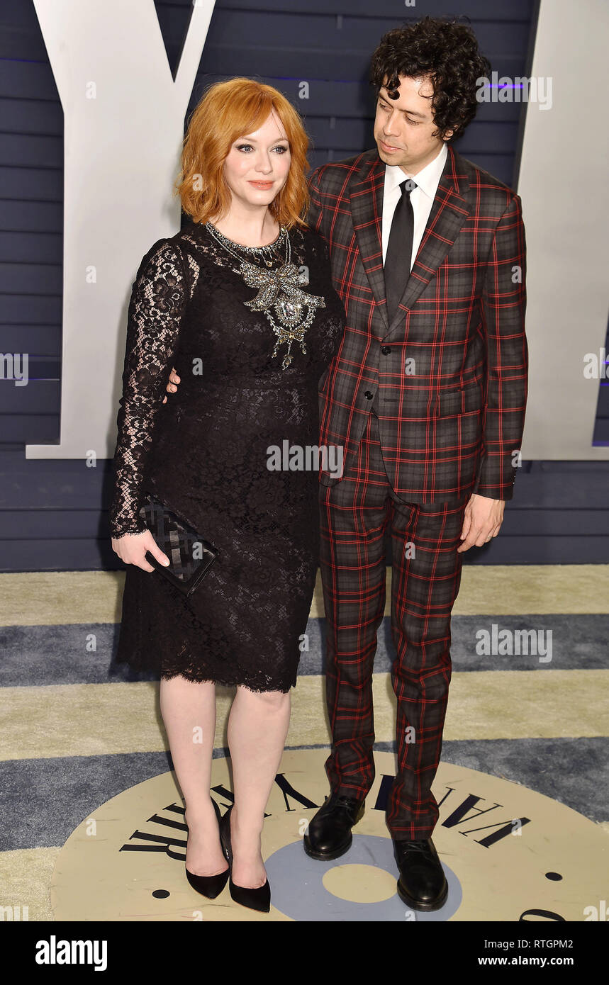 BEVERLY HILLS, CA - FEBRUARY 24: Christina Hendricks (L) and Geoffrey