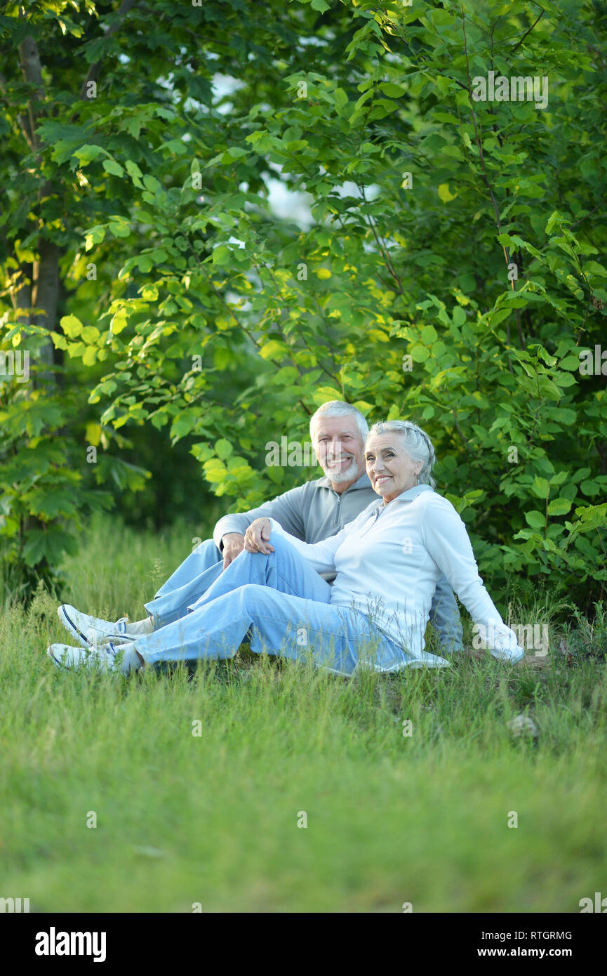 Portrait of beautiful smiling senior couple in the park Stock Photo - Alamy