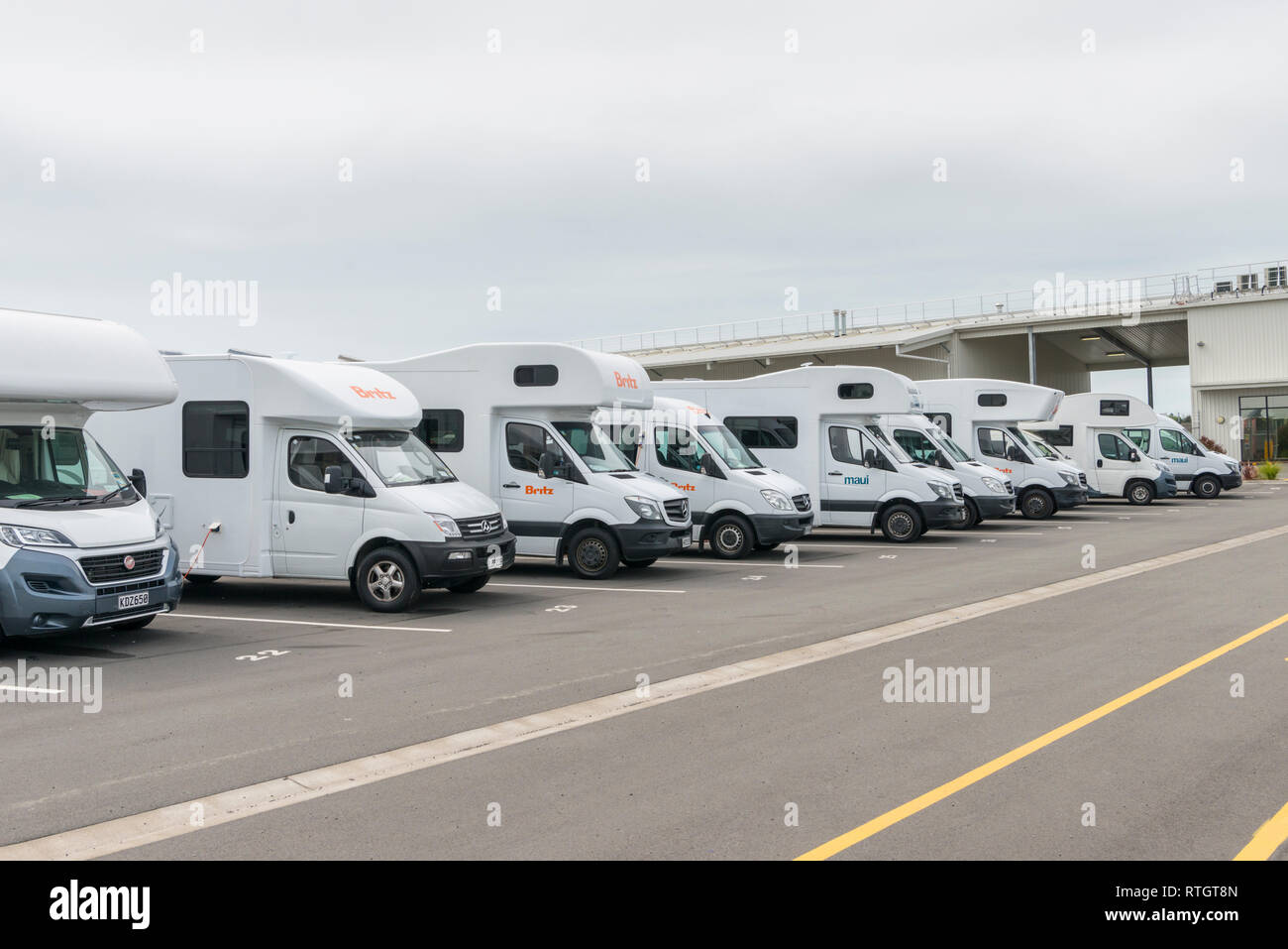 Motorhomes and campervans parked in a hire depot in Christchurch New