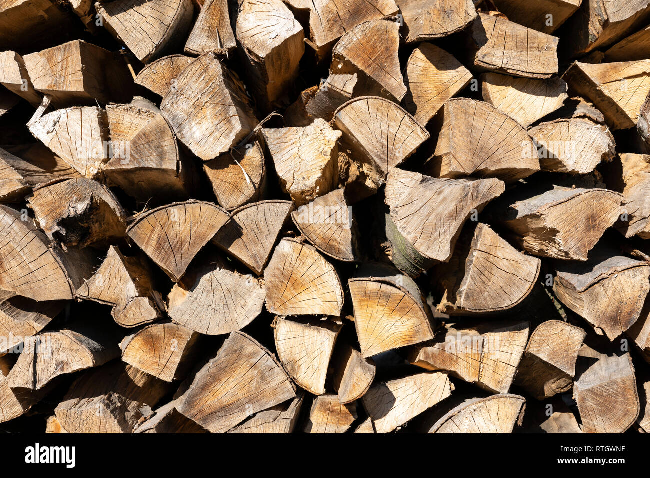 Stacked firewood during winter time for household use in Lower Austria Stock Photo