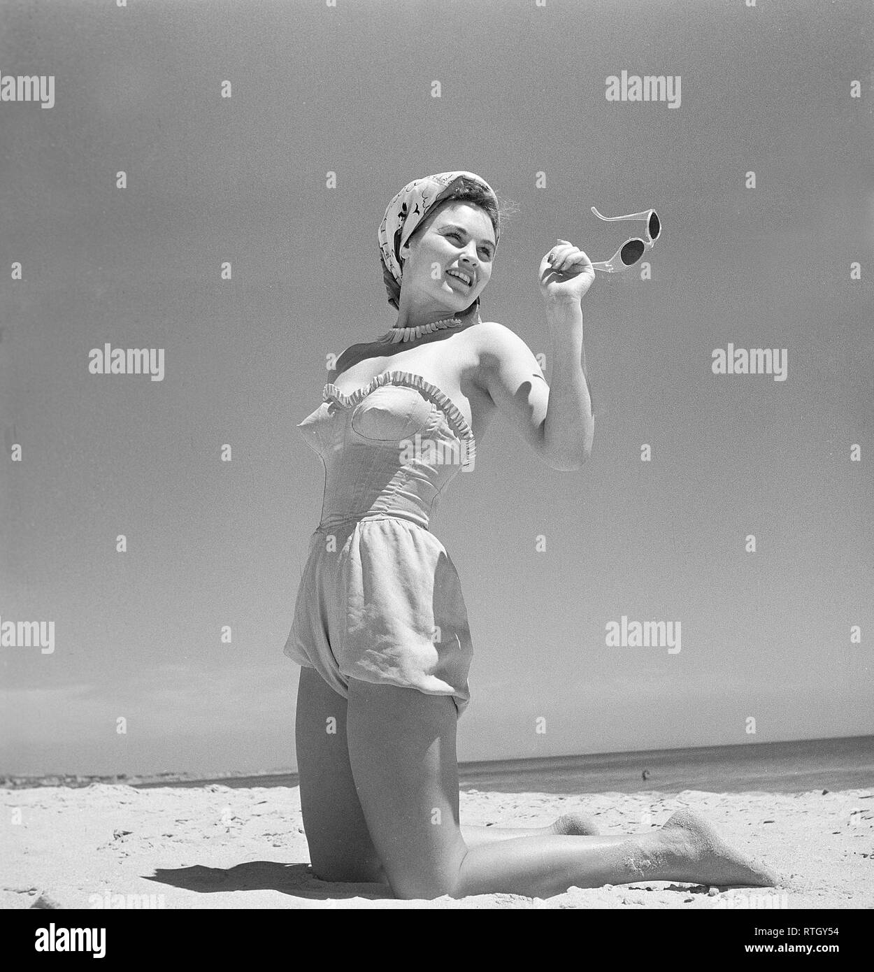 1940s Summer A Young Woman By The Sea Is Getting A Nice Suntan