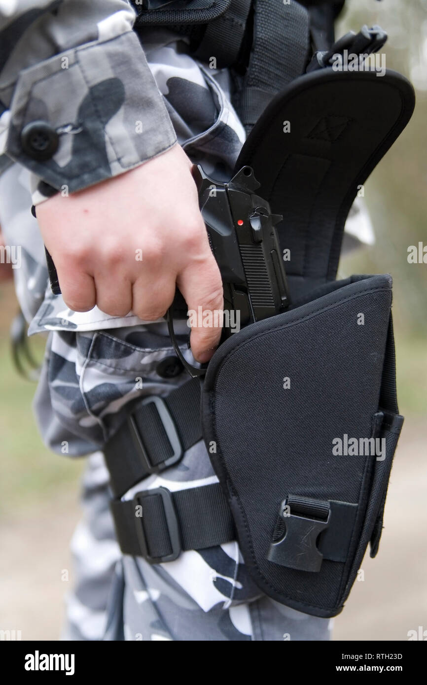 gun holster with a 9mm weapon inside Stock Photo