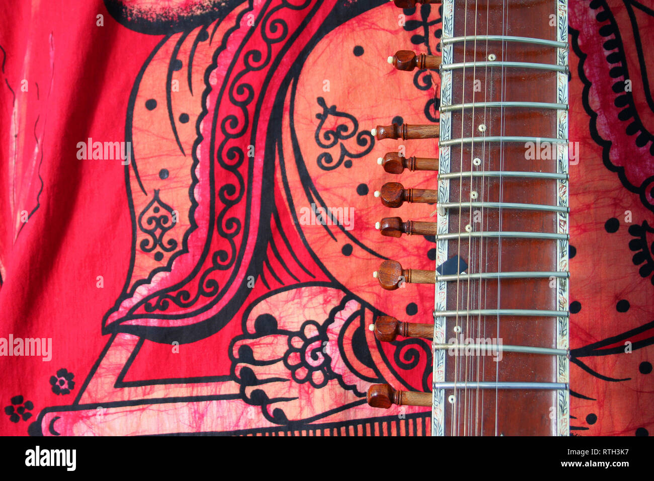 old sitar on red background ancient indian instrument Stock Photo Alamy