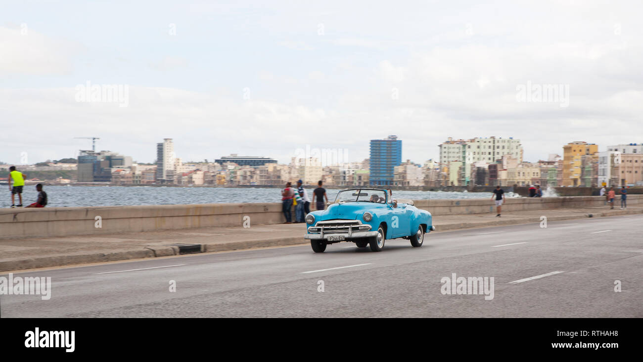 Classic 1950's American car road trip driving along the Malecon in Havana Cuba Stock Photo
