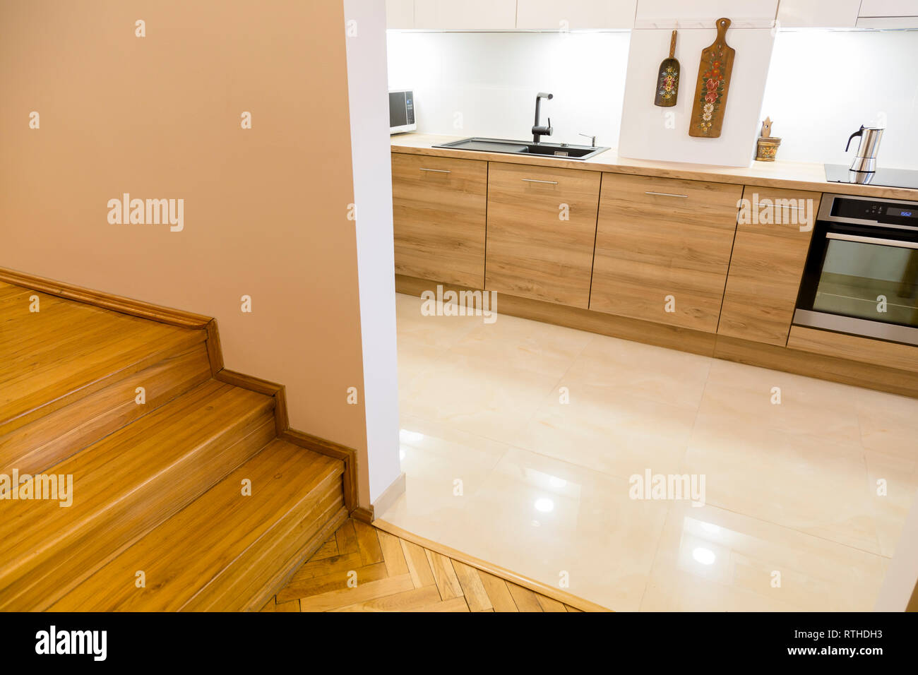 Aesthetic modern narrow kitchen with wooden furnitures Stock Photo Alamy