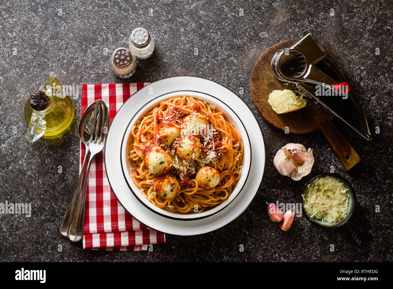 Italian pasta spaghetti with ricotta cheese balls in tomato sauce on
