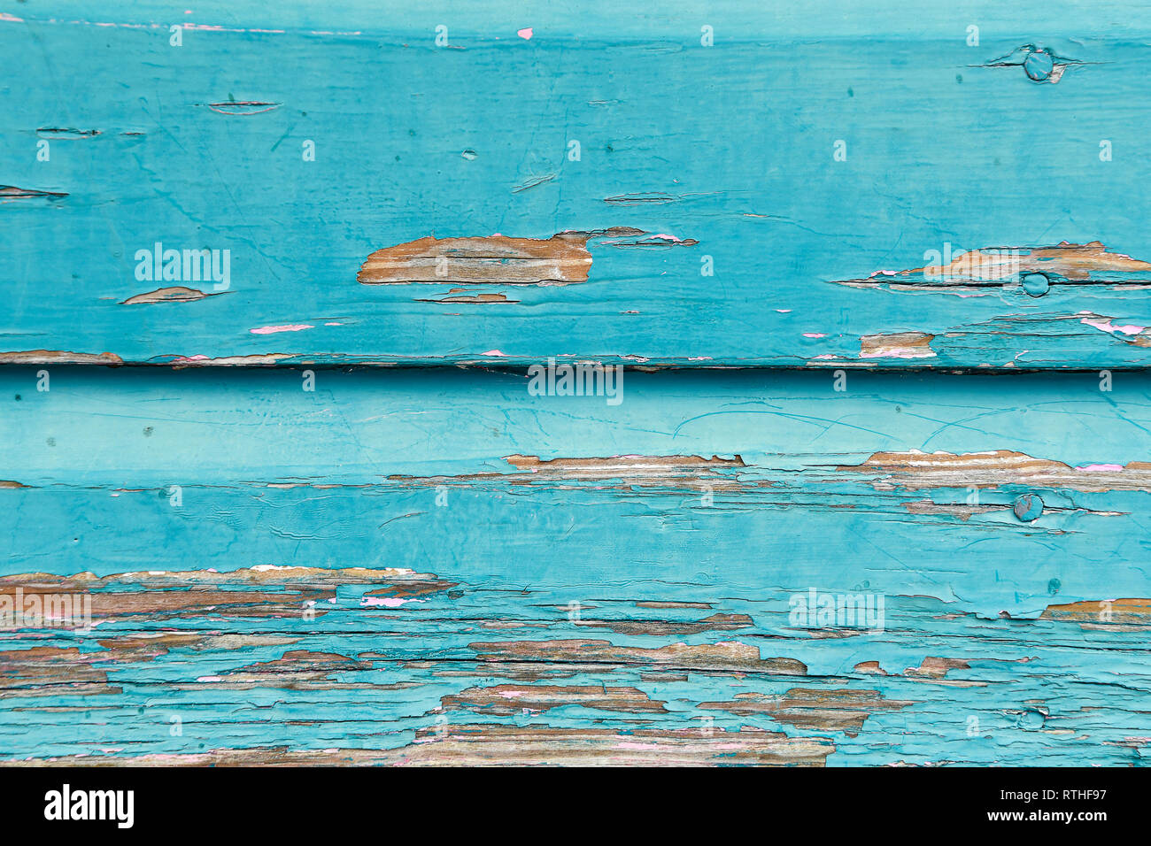 close up of peeling weathered turquoise paint on rustic shabby chic wood Stock Photo