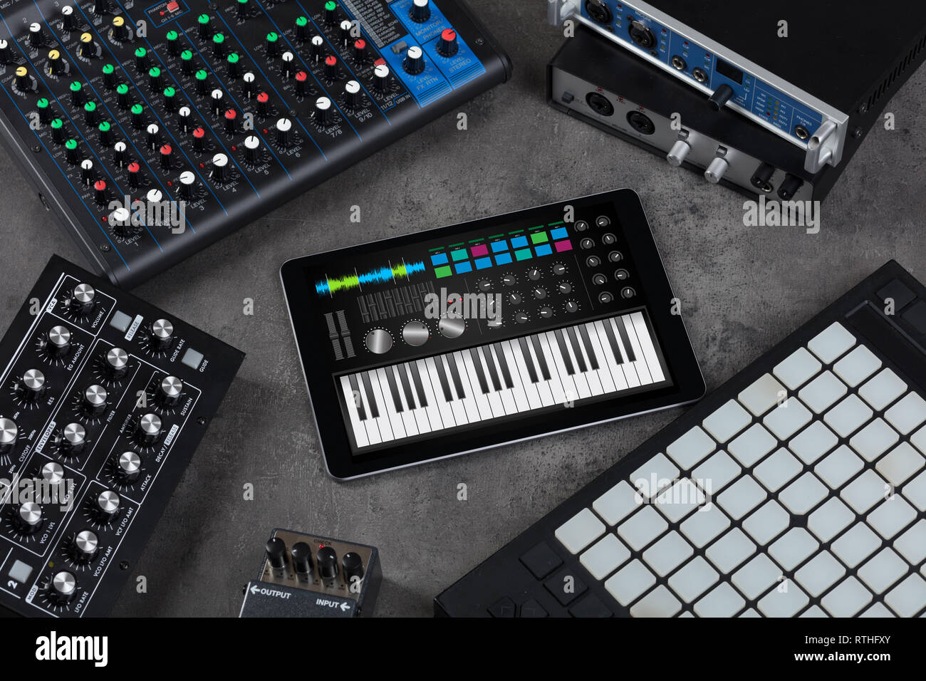 Piano synthesizer app on tablet and musical instrument concept Stock