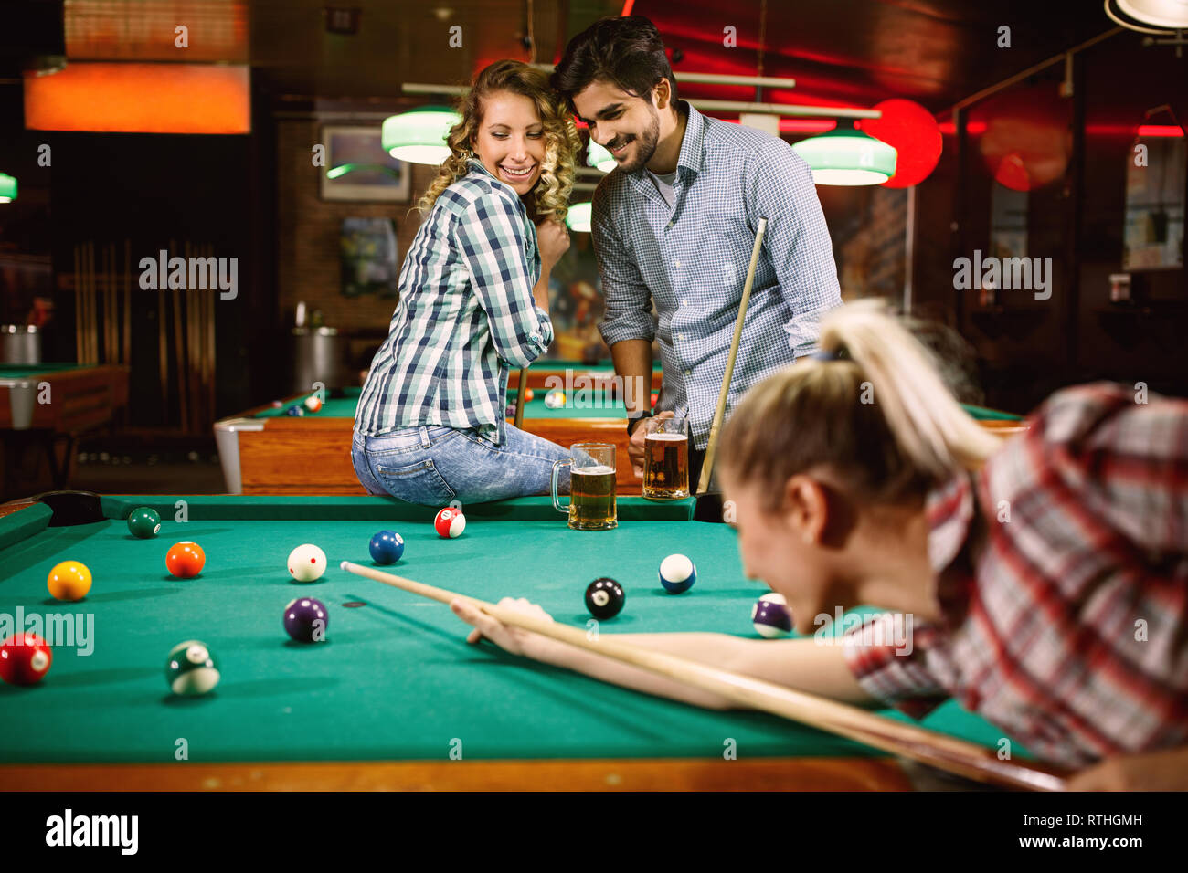 Friends Cheering While Their Friend Aiming For Billiards Ball Stock Photo,  Picture and Royalty Free Image. Image 28035174.